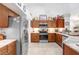 Spacious kitchen with stainless steel appliances, marble counter tops, and abundant wooden cabinetry at 5013 119Th E Ter, Parrish, FL 34219