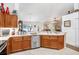 Eat-in kitchen with stainless steel appliances and marble counter tops which overlooks the living room at 5013 119Th E Ter, Parrish, FL 34219
