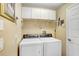 Functional laundry room with modern washer and dryer at 5013 119Th E Ter, Parrish, FL 34219