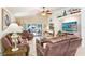 Inviting living space with comfortable seating, bright lighting, and access to both the back patio and bedroom at 5013 119Th E Ter, Parrish, FL 34219