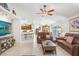 Spacious living room with tile flooring, vaulted ceilings, a ceiling fan, and an open layout at 5013 119Th E Ter, Parrish, FL 34219