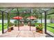 Relaxing screened patio with brick flooring and view of the backyard at 5013 119Th E Ter, Parrish, FL 34219