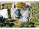 Aerial view of a property showcasing the house, pool, landscaping, and surrounding neighborhood at 5657 Oceanic Rd, Holiday, FL 34690