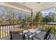 Enjoy this back deck with outdoor furniture and a view of the landscaped backyard at 5657 Oceanic Rd, Holiday, FL 34690