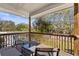 Relax on the covered back deck with a view of the pool area at 5657 Oceanic Rd, Holiday, FL 34690