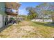 Large backyard with deck and screened in pool, perfect for outdoor gatherings at 5657 Oceanic Rd, Holiday, FL 34690