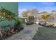 Lush backyard patio with mature landscaping and a screened in pool area at 5657 Oceanic Rd, Holiday, FL 34690