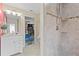 Featuring an updated bathroom with dual access and a tiled shower stall at 5657 Oceanic Rd, Holiday, FL 34690