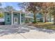 Stunning home featuring a unique color scheme and eye-catching architectural details at 5657 Oceanic Rd, Holiday, FL 34690