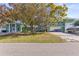 The property boasts ample parking, lush landscaping, and a well-maintained exterior at 5657 Oceanic Rd, Holiday, FL 34690