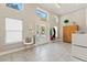 Bright and airy foyer with tile flooring, high ceilings, and stylish furniture at 5657 Oceanic Rd, Holiday, FL 34690
