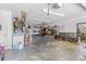 Large two car garage featuring ample space for storage and work area at 5657 Oceanic Rd, Holiday, FL 34690