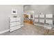 Spacious hallway featuring elegant flooring and connecting to the kitchen and dining area at 5657 Oceanic Rd, Holiday, FL 34690