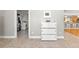 Hallway connecting the laundry room to the open kitchen and dining area at 5657 Oceanic Rd, Holiday, FL 34690