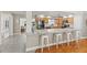 Modern kitchen featuring a breakfast bar with seating and stainless steel appliances at 5657 Oceanic Rd, Holiday, FL 34690