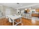 Open concept kitchen and dining area with bar seating and modern appliances at 5657 Oceanic Rd, Holiday, FL 34690