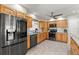 Kitchen featuring stainless steel appliances and classic wood cabinetry at 5657 Oceanic Rd, Holiday, FL 34690