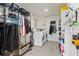 Well-organized laundry room with modern washer, dryer, and plenty of storage space at 5657 Oceanic Rd, Holiday, FL 34690