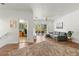 Open-concept living room leading to an office space and a patio at 5657 Oceanic Rd, Holiday, FL 34690