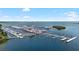 Aerial view of a marina with boats docked and the city skyline in the background at 6113 Yeats Manor Dr, Tampa, FL 33616