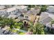 Aerial view of a two-story home featuring a brick driveway and mature trees in a residential neighborhood at 6113 Yeats Manor Dr, Tampa, FL 33616