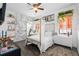 Unique bedroom design with king bed, statement wall decor, and modern finishes at 6113 Yeats Manor Dr, Tampa, FL 33616
