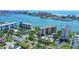 Expansive aerial view showcasing waterfront condos, marina, and beautiful coastal community at 650 Island Way # 408, Clearwater Beach, FL 33767