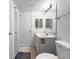Small white bathroom with vanity and tiled floors, offering a clean and minimalist design at 650 Island Way # 408, Clearwater Beach, FL 33767