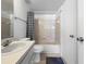 Well-lit bathroom with white vanity, tiled shower, and neutral decor for a clean, simple design at 650 Island Way # 408, Clearwater Beach, FL 33767