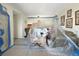 Living Room space covered in plastic for renovation, showcasing potential and natural light at 650 Island Way # 408, Clearwater Beach, FL 33767