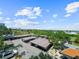 Overhead shot of a parking lot filled with cars and plenty of trees at 650 Island Way # 408, Clearwater Beach, FL 33767