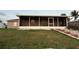 A fenced backyard features a screened in porch perfect for outdoor living at 6820 26Th W St, Bradenton, FL 34207