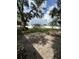 Large backyard featuring mature trees and a white fence at 7536 38Th N Ave, St Petersburg, FL 33710