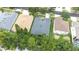 An aerial shot exhibits the house's roofing, location, and landscaping in a suburban neighborhood at 8814 N River Rd, Tampa, FL 33635