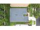 An aerial view of the house showing the roof, landscaping, and surrounding neighborhood at 8814 N River Rd, Tampa, FL 33635