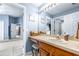 Bathroom featuring a vanity with a single sink, large mirror, and neutral countertop at 8814 N River Rd, Tampa, FL 33635