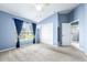 Spacious bedroom with large window and closet offering an abundance of natural light at 8814 N River Rd, Tampa, FL 33635