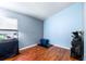 Guest bedroom with hardwood floors, large window and pet amenities at 8814 N River Rd, Tampa, FL 33635