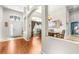 Welcoming entryway and dining room boasts archways, natural light, and attractive wood flooring at 8814 N River Rd, Tampa, FL 33635