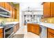 Bright kitchen featuring wooden cabinets, stainless steel appliances and breakfast nook at 8814 N River Rd, Tampa, FL 33635