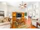 Spacious living room features wood floors, media center and access to other rooms of the home at 8814 N River Rd, Tampa, FL 33635