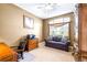 Cozy office space featuring a comfortable sofa, complemented by a ceiling fan for added comfort at 8814 N River Rd, Tampa, FL 33635