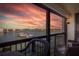 Balcony seating overlooking a beautiful harbor with boats at 9525 Blind Pass Rd # 505, St Pete Beach, FL 33706