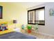 Bright bedroom featuring modern decor and views to the outside at 9525 Blind Pass Rd # 505, St Pete Beach, FL 33706