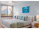 Updated bedroom features water views, bright walls and beachy decor at 9525 Blind Pass Rd # 505, St Pete Beach, FL 33706