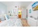 Bedroom showcases an ensuite bathroom and beachy decor at 9525 Blind Pass Rd # 505, St Pete Beach, FL 33706