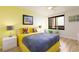 Cozy bedroom featuring a ceiling fan, balcony access and city views at 9525 Blind Pass Rd # 505, St Pete Beach, FL 33706