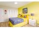 Cheerful bedroom with closet space, colorful decor and side table at 9525 Blind Pass Rd # 505, St Pete Beach, FL 33706