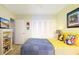 Comfortable bedroom showcasing a dresser, closet and light-toned walls at 9525 Blind Pass Rd # 505, St Pete Beach, FL 33706