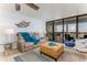 Comfortable living room with a large window that provides natural light and beautiful views at 9525 Blind Pass Rd # 505, St Pete Beach, FL 33706